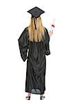 Full length portrait of woman in graduation gown showing diploma . rear view