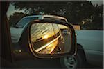 View of sunset in wing mirror of car, Austin, Texas, USA