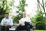 Businessmen working on Park Bench, Mannheim, Baden-Wurttemberg, Germany