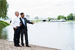 Businessmen Standing by River, Mannheim, Baden-Wurttemberg, Germany