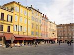 colourful buildings and cafes lining courtyard in Modena Italy