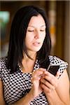 Woman Sending Text Message on a Smartphone.