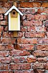 Nesting box on brick wall, close-up