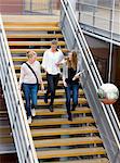 Three university student on stairs
