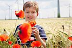 Little Boy In Field, In Background Wind Turbines, Dessau, Germany, Europe