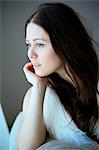 Woman with brown hair, day dreaming, Copenhagen, Denmark