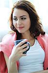 Woman with brown hair having a cup of coffee, Copenhagen, Denmark