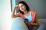 Young woman with brown hair having a cup of coffee, Copenhagen, Denmark