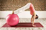 Woman Doing Pilates With Fitness Ball, Munich, Bavaria, Germany, Europe