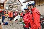 Mountain Bikers Holding Map, Schwangau-Bleckenau, Bavaria, Germany