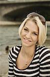 Young woman in a stripy shirt outdoors, portrait, Munich, Bavaria, Germany