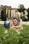 Young couple relaxes outdoors, Munich, Bavaria, Germany