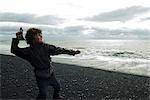 Boy who ricochets on the beach Iceland