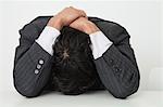 Businessman resting head on desk