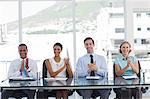 Group of business people applauding in the workplace