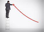 Businessman standing on ladder drawing red curve arrow