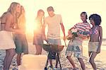 Friends having a barbecue on the beach