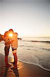 Cute lovers embracing each other on the beach