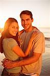 Cute lovers embracing on the beach