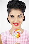 Cheerful young pinup with a lollipop