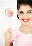 Cute young pinup showing her lollipop