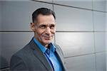 Portrait of businessman standing in front of building, Mannheim, Germany