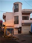 Street view with cow at dusk in old quarter of Binda, India