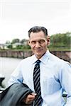 Portrait of mature businessman outdoors, smiling at camera, Mannheim, Germany