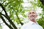 Close-up portrait of mature man in park, Mannheim, Germany