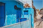 blue lime plaster on the wall of a traditional Indian house in street of Kumbhalgarh Fort, Rajasthan, India