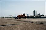 Mature man doing push-ups on loading dock, Mannheim, Germany