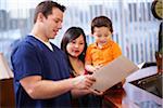 Dentist with file folder talking with mother and child.