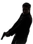 one man killer policeman holding gun silhouette studio white background