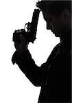 one man killer policeman holding gun portrait silhouette studio white background