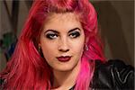 Close up of young punk rocker female with pink hair