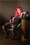 Young punk woman in leopard skin tights indoors