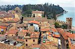 View from above on typical old houses with red roofs of Sirmione - town on Lake Garda in Italy.