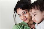 Indian Happy mother and baby looking at others