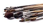 old paint brushes on a white background