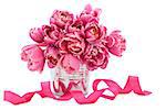 Pink tulip flower arrangement in a metal vase with ribbon over white background.