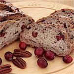 Cranberry and pecan bread on a beech wood bread board.