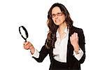angry business woman is very upset with and a magnifying glass in hand