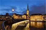 Illuminated Fraumunster Church and River Limmat in Zurich, Switzerland