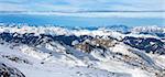 winter with ski slopes of kaprun resort next to kitzsteinhorn peak in austrian alps