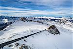 Winter with ski slopes of kaprun resort next to kitzsteinhorn peak in austrian alps