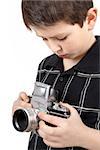 young boy with old vintage analog SLR camera looking to viewfinder