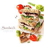 Sandwiches with meet, vegetables and mustard on crusty fresh sliced rye bread.