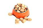 dog dry food - snacks in orange bowl isolated