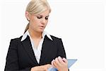 Businesswoman holding a tablet computer against white background