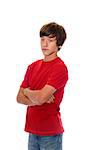 Young sad boy with arms crossed isolate on white background.